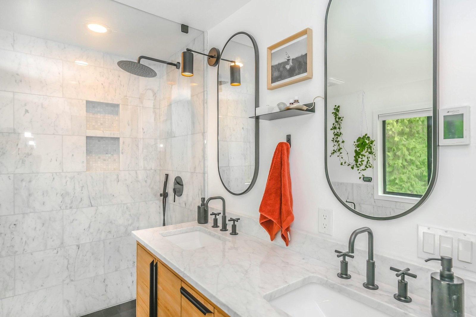 Modern Bathroom in Estero with a tile shower, marble counter tops, and grey accents.