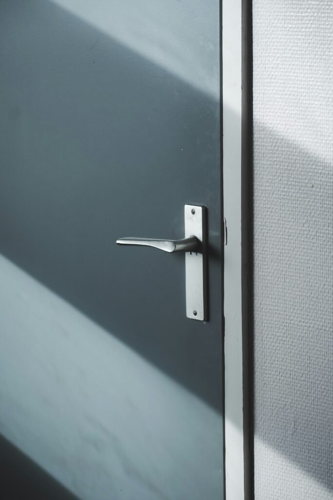 A new, silver door handle installed on an apartment door in Marco Island.